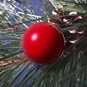 Környezetét csillogóan tükröző karácsonyfa díszgömb.